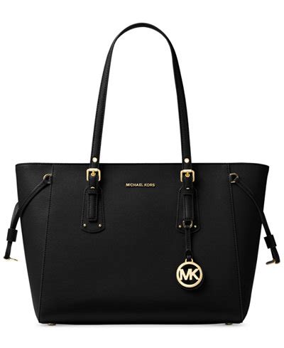 michael kors voyager medium multifunction top zip tote|Michael Kors handbag logo.